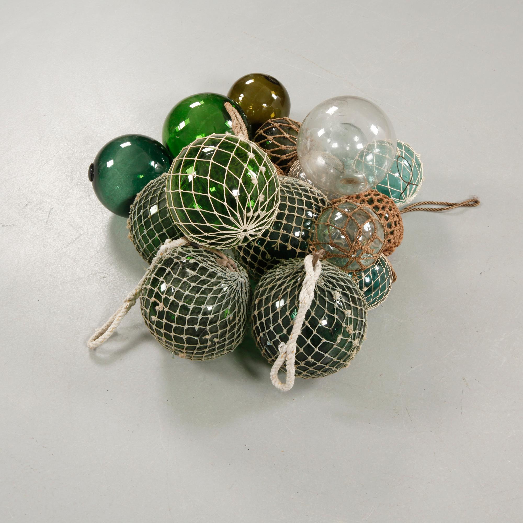 Seventeen glass fishing floats, 20th century.