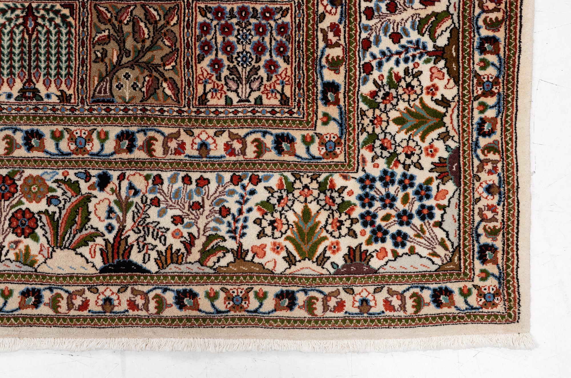 A Moud carpet, part silk, approx. 285 x 195 cm.
