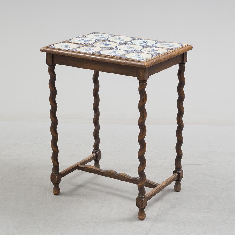 A 20th century Baroque-style table with tiles.