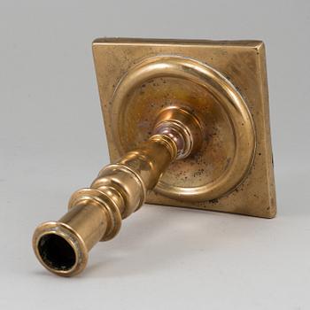 A 17th century bronze candlestick.