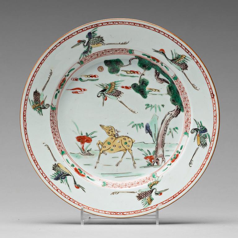 A set of 12 famille verte dinner plates, Qing dynasty, Kangxi (1662-1722).