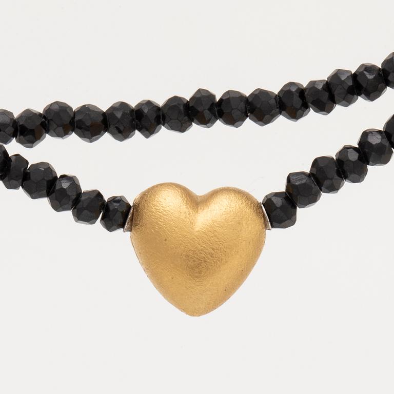 Ole Lynggaard, necklace faceted onyxbeads and clasp 18K gold, dustbag and original case.