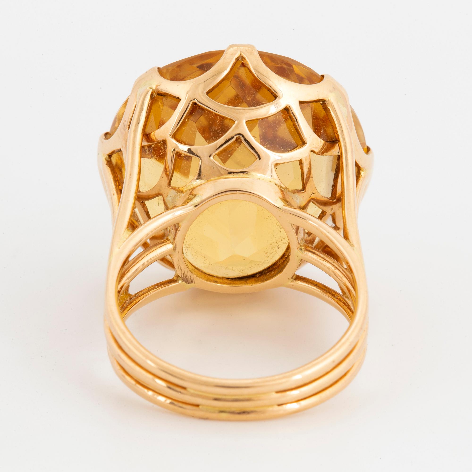 Round mixed-cut citrine cocktail ring.