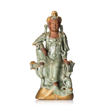 995. A celadon glazed figure of Guanyin, Ming dynasty (1368-1644).