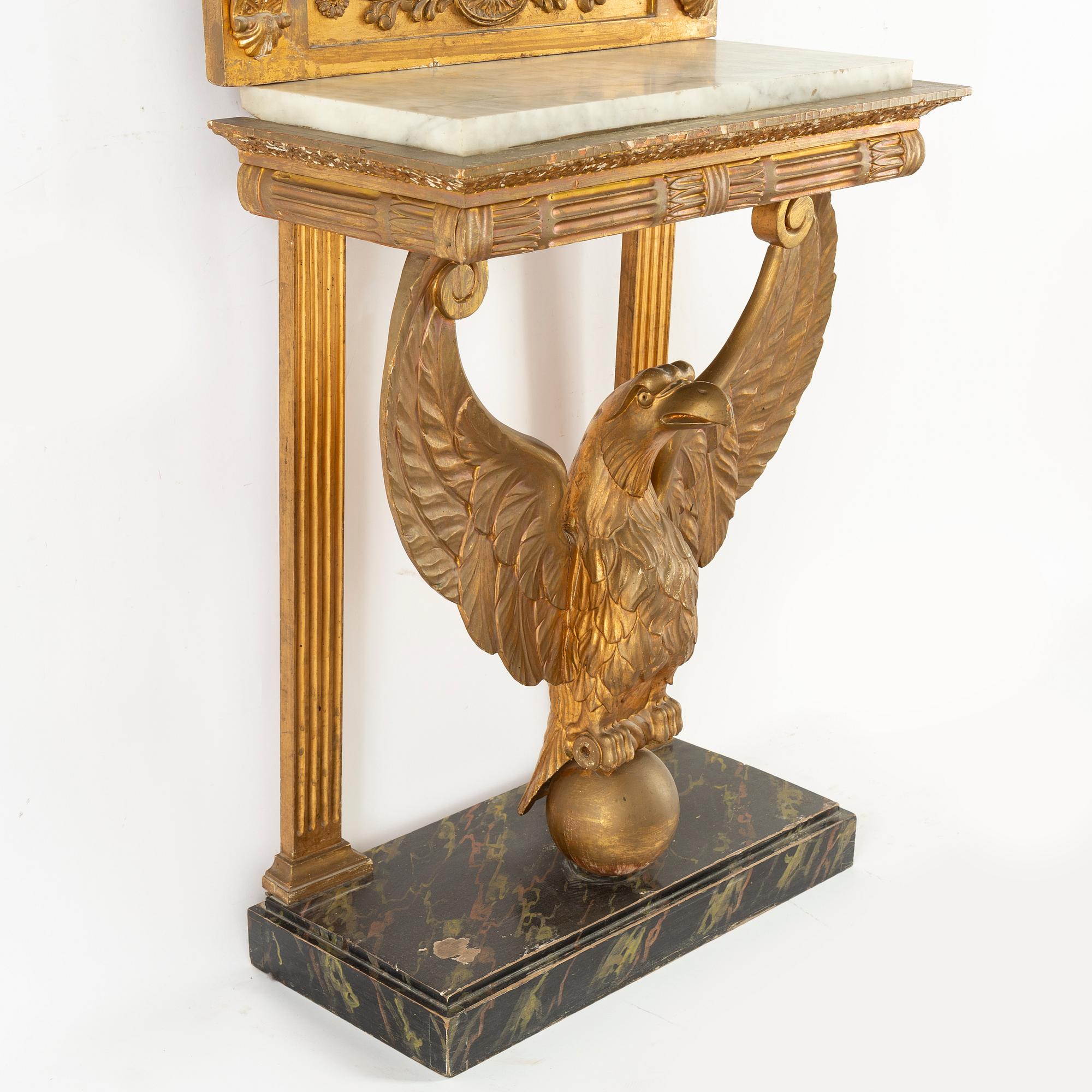 A Swedish Empire Mirror frame and console table, first half of the 19th century.