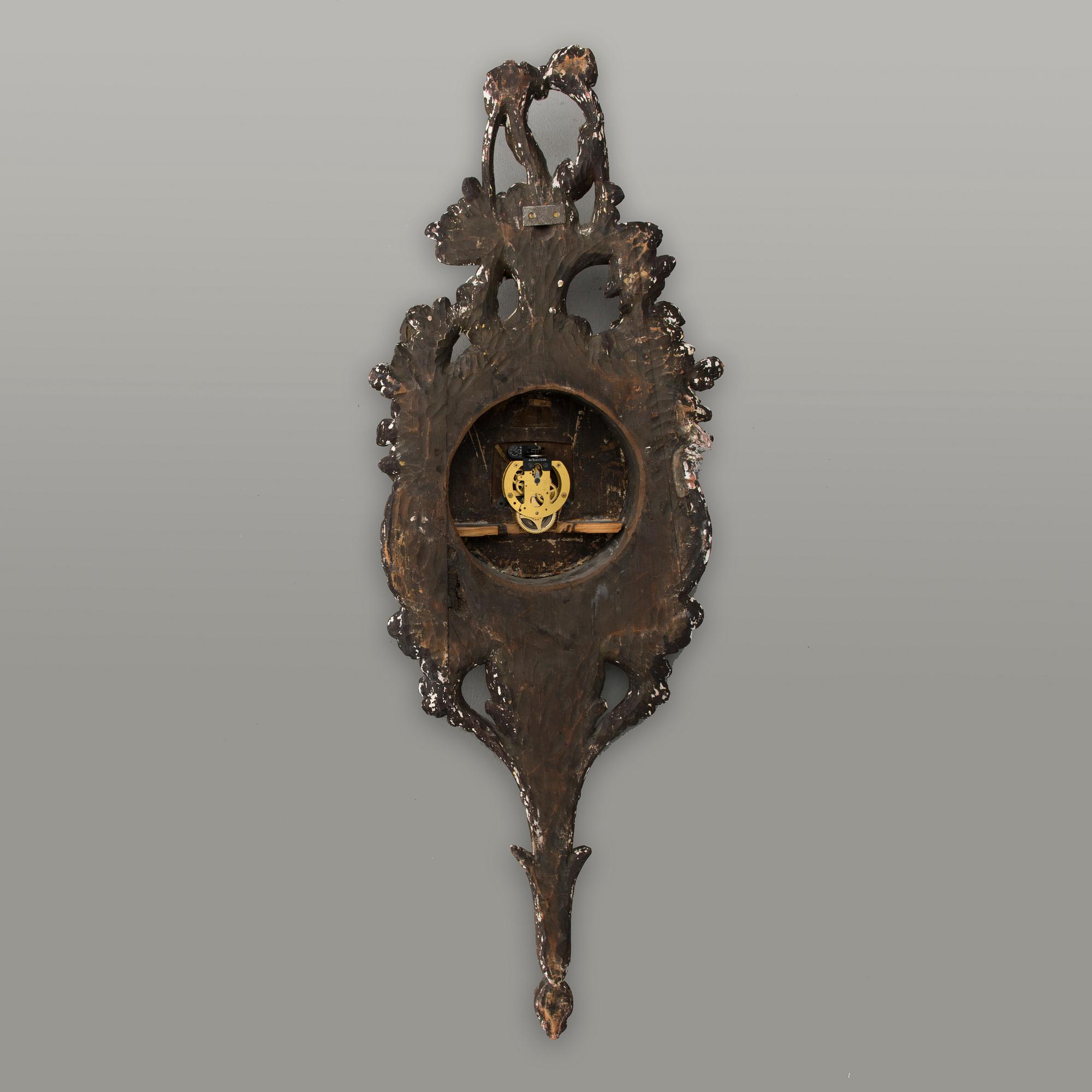 A 18th century wall clock.