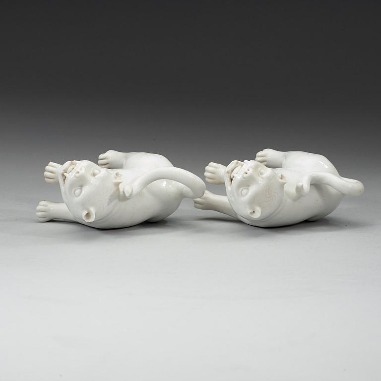 A set of two blanc de chine mythological animals, late Qing dynasty.