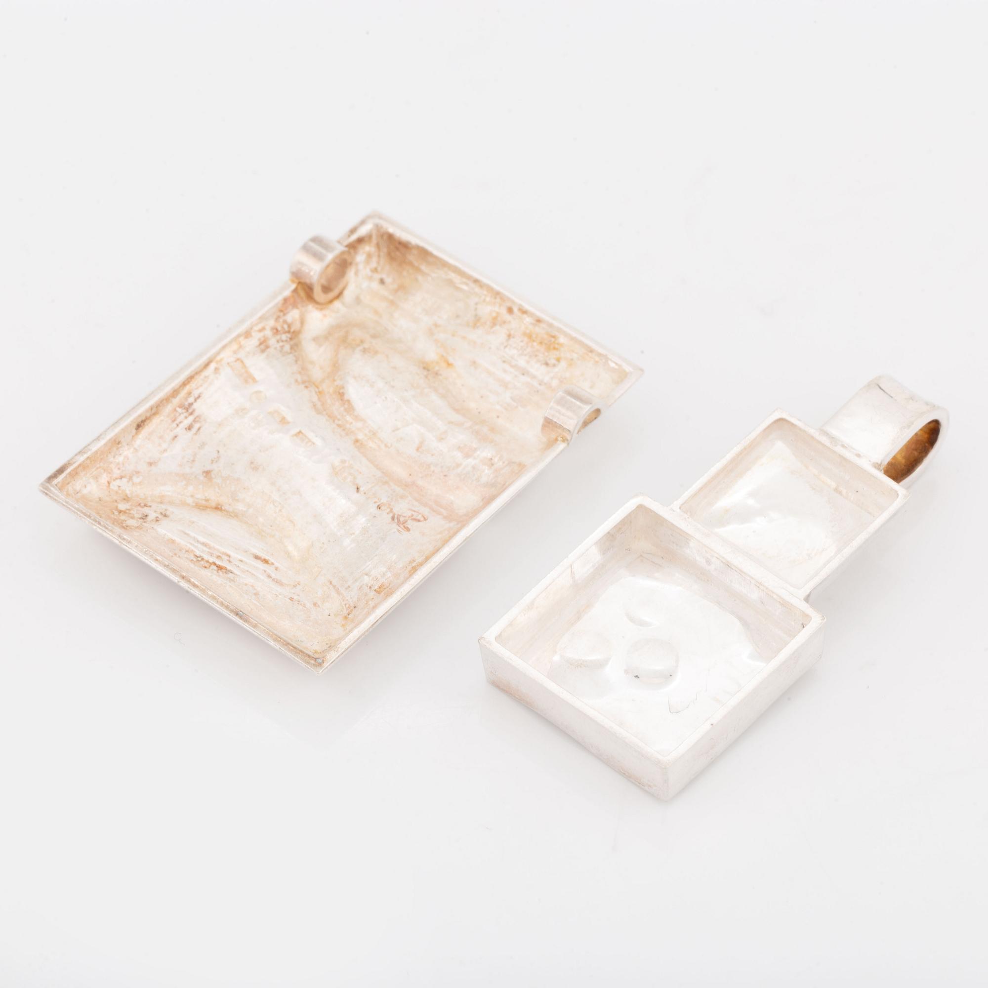 Rolf Karlsson two silver pendants.