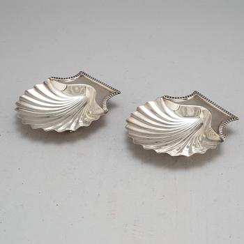 An English early 19th century pair of silver butter-shells, mark of London 1807.