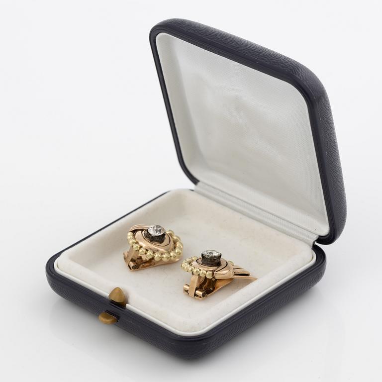 A pair of earrings in 14K gold set with old-cut diamonds.