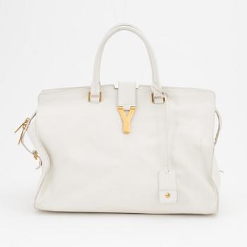 Yves Saint Laurent, a white leather handbag.