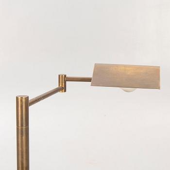 A 21st century brass floor lamp.