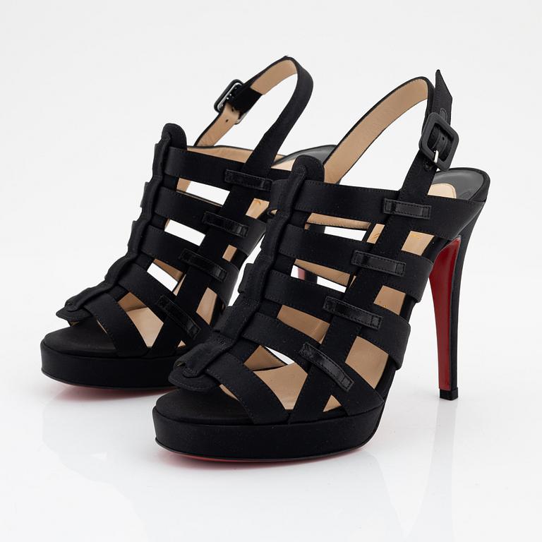 Christian Louboutin, a pair of black silk sandals, size 37 1/2.