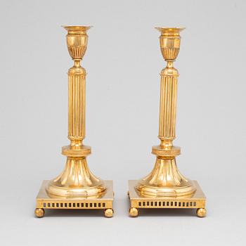 A pair of Skultuna brass candlesticks, No 71, early 20th Century.