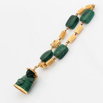 A 14K gold and malachite bracelet.