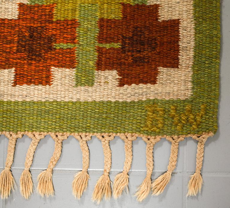 A flat weave by Berit Woelfer, signed BW, third quarter of the 20th century, 238 x 197 cm.