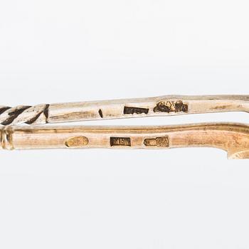 Twelve parcel-gilt teaspoons and a jam spoon, Russia 1887-1926.