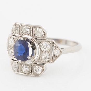 Platinum ring with sapphire and old-cut diamonds.