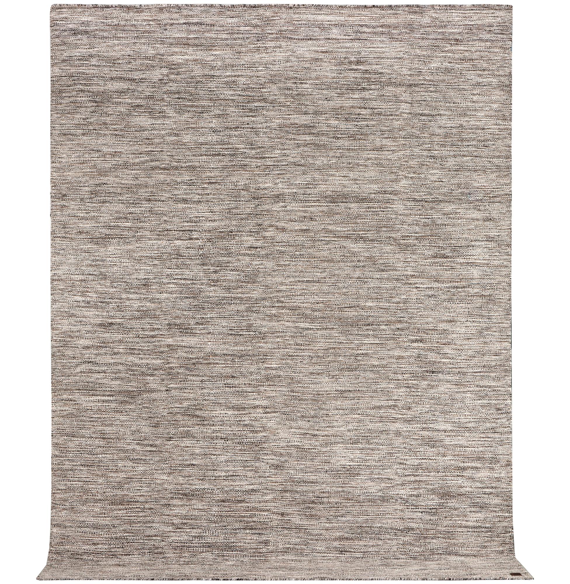 A flat weave carpet, c. 337 x 328 cm.
