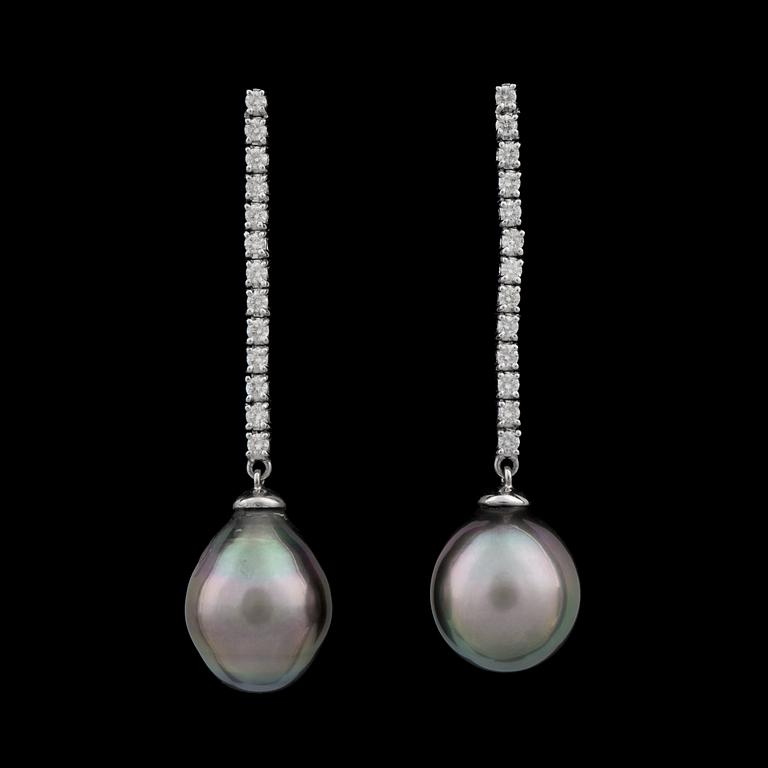 A pair of cultured tahiti pearl and diamond app. tot. 0.62 cts earrings.
