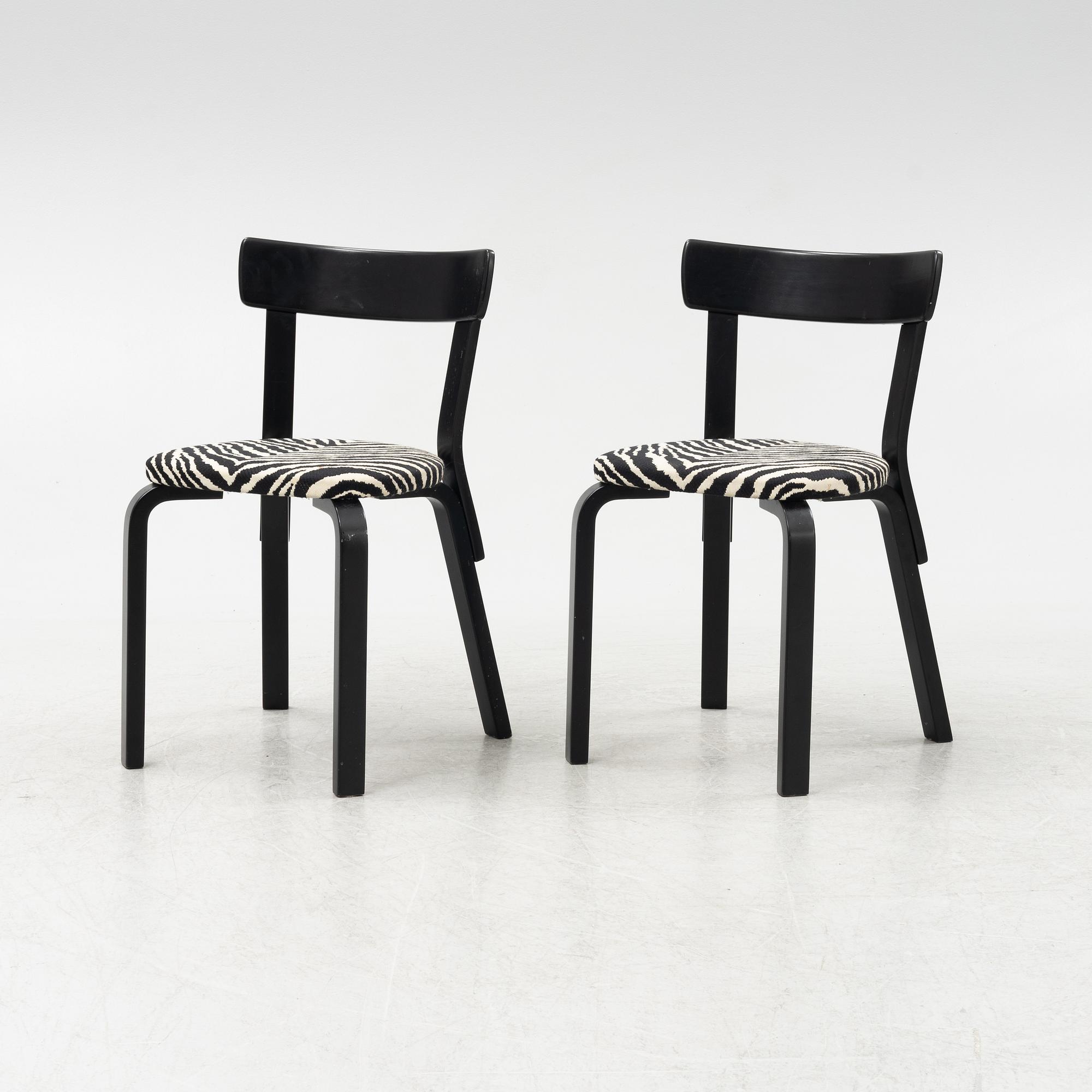 Alvar Aalto, a dining table and eight chairs, model 69, Artek, Finland, end of the 20th century.