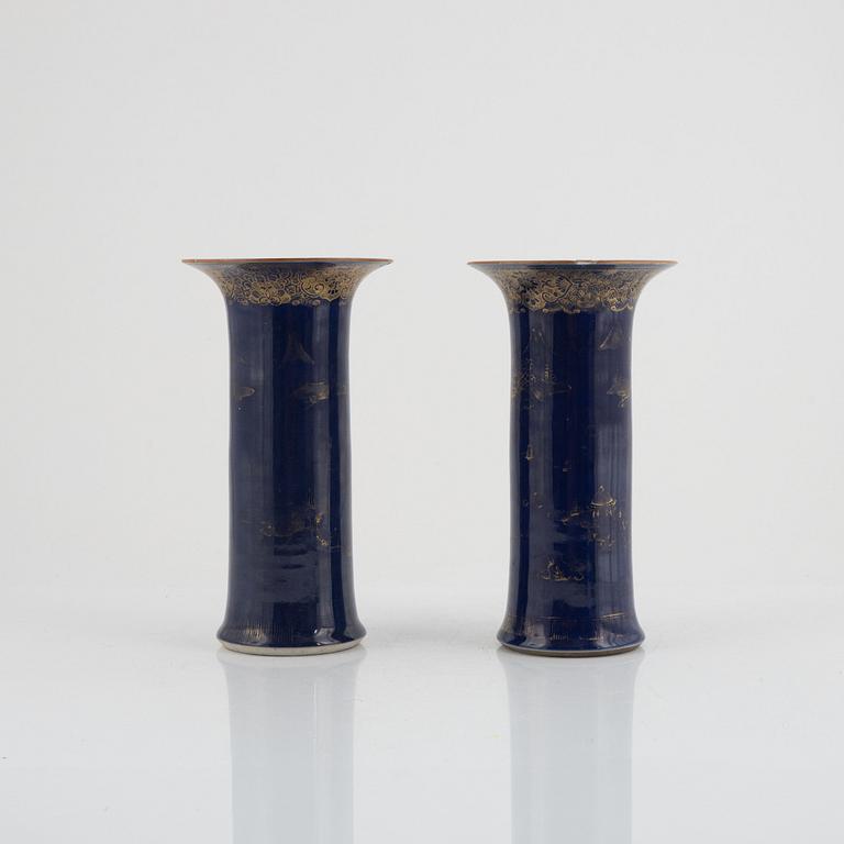 A pair of powder blue and gold 'trumpet' vases, Qing dynasty, 18th century.