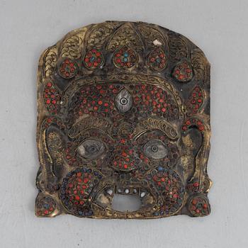 A stone inlay mask, Nepal, early 20th century.