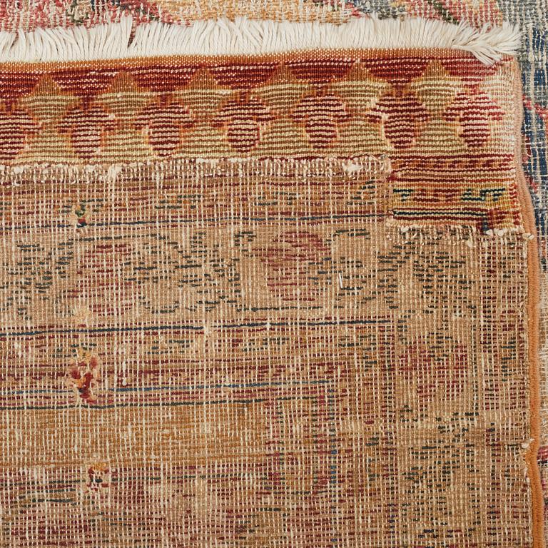 A CARPET FRAGMENT, an antique Indian, Mughal Empire 17th-18th century probably, saf, ca 277 x 136 cm.