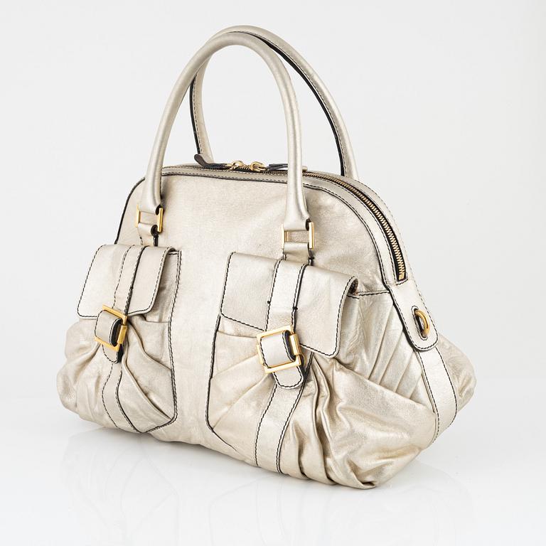 Valentino Garavani, A metallic leather bag.