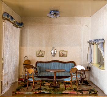 A doll house with interior including Nolbyn and Nordiska Kompaniet first half of the 20th century.