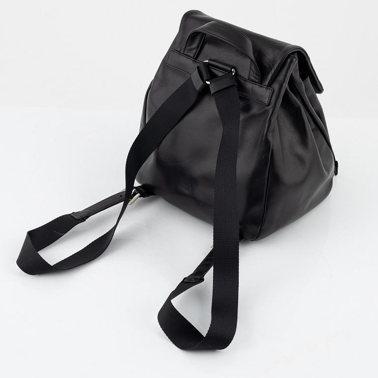 Prada, a leather backpack.