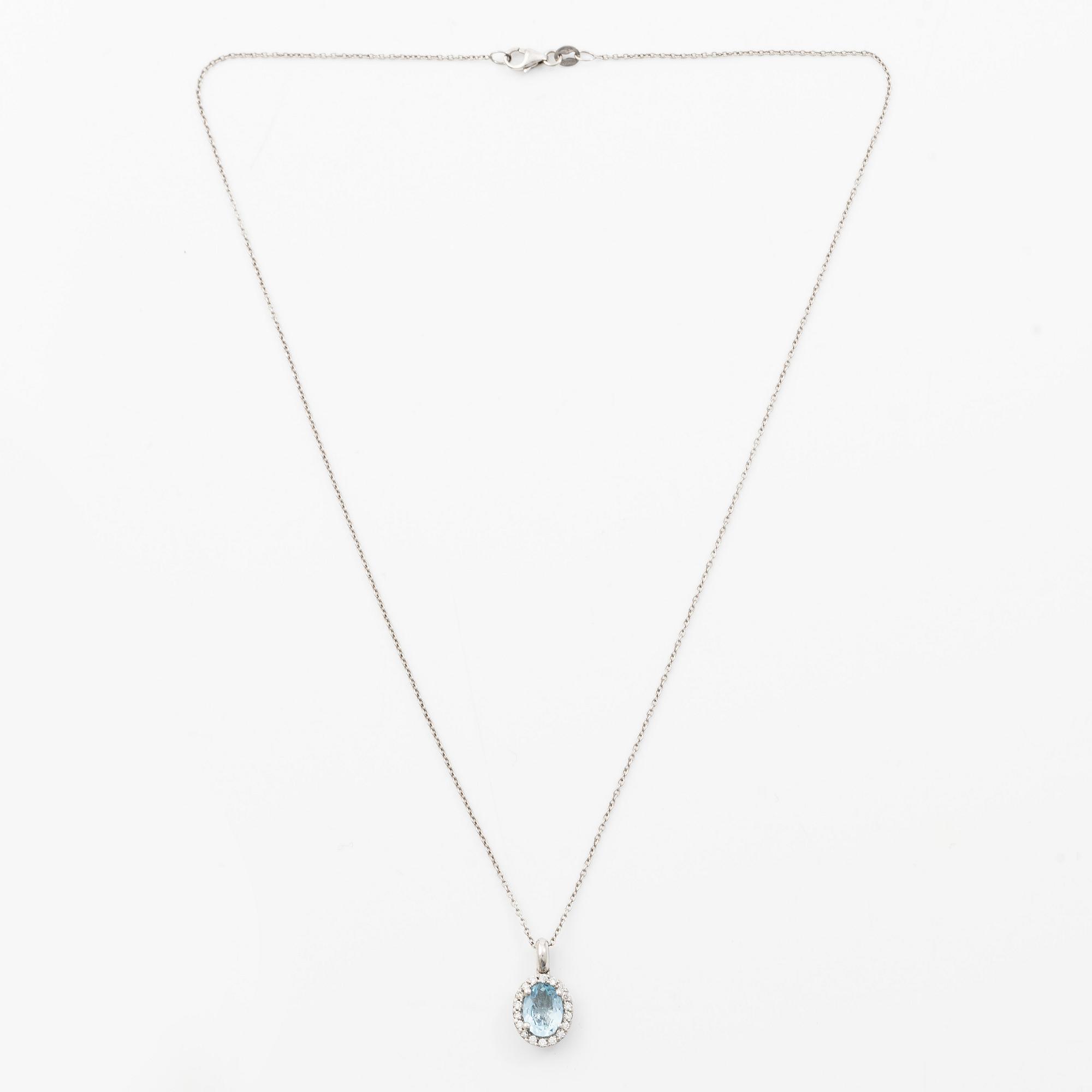 Pendant with chain in 18K white gold set with a faceted aquamarine and round brilliant-cut diamonds.