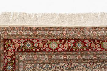 A rug, old, silk Hereke, signed, ca 166,5 x 109 cm.