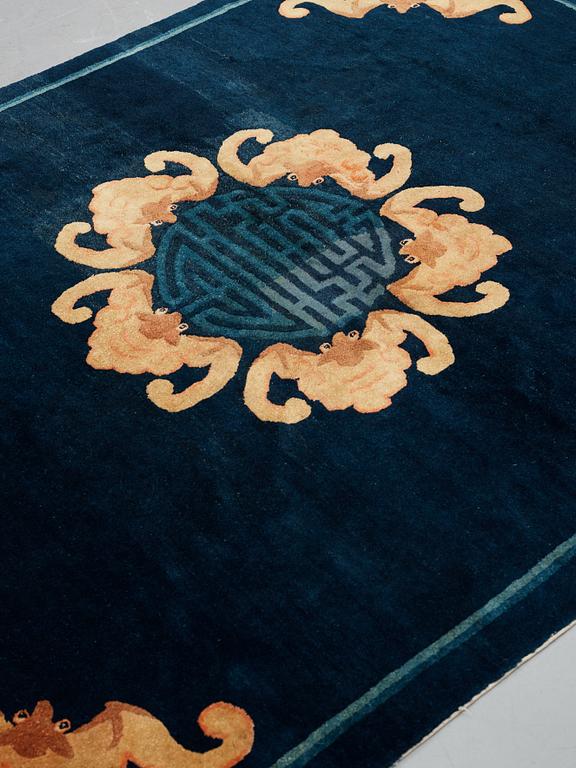 A carpet, a semi-antique Chinese,  ca 255 x 199-202,5 cm.