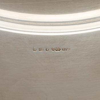 Four monogrammed Swedish silver charger plates, Makers's mark GAB, Stockholm, 1949.