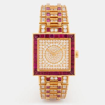 925. A Bulgari wristwatch in 18K gold set with step-cut rubies and round brilliant-cut diamonds.