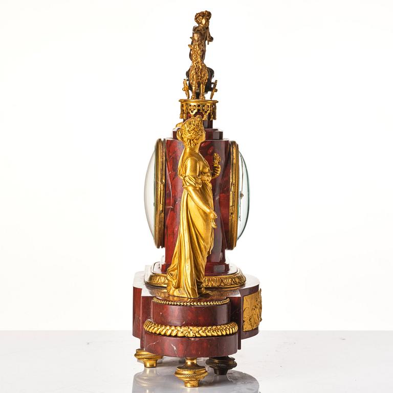 A French Empire 19th century gilt bronze mantel clock signed Lamiral.