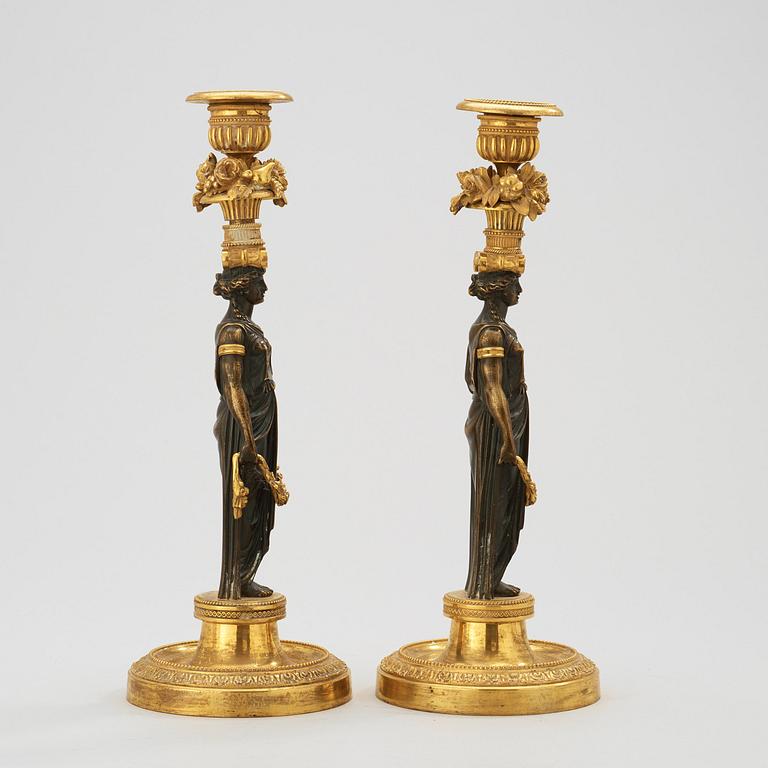 A pair of Empire early 19th century candlesticks.