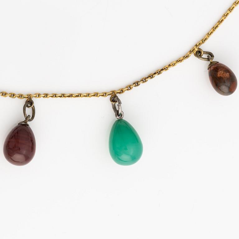 Collier med smyckesägg, 14K guld och metall.