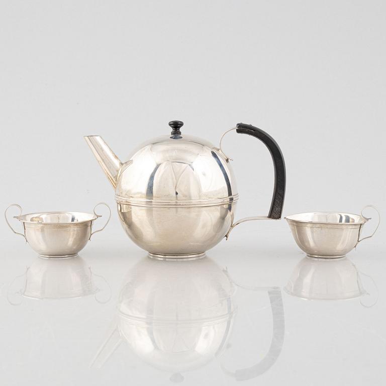 A Swedish Art Déco Silver Coffee Pot, Creamer and Sugar Bowl, mark of CG Hallberg, Stockholm 1936.