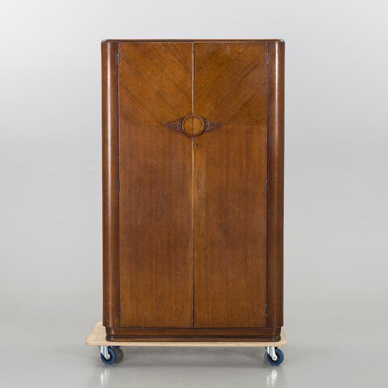 An English Lebus Furniture mens wardrobe around 1900.