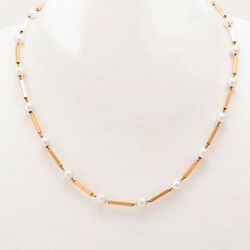 A set of 18K gold necklace and earrings with cultured pearls.