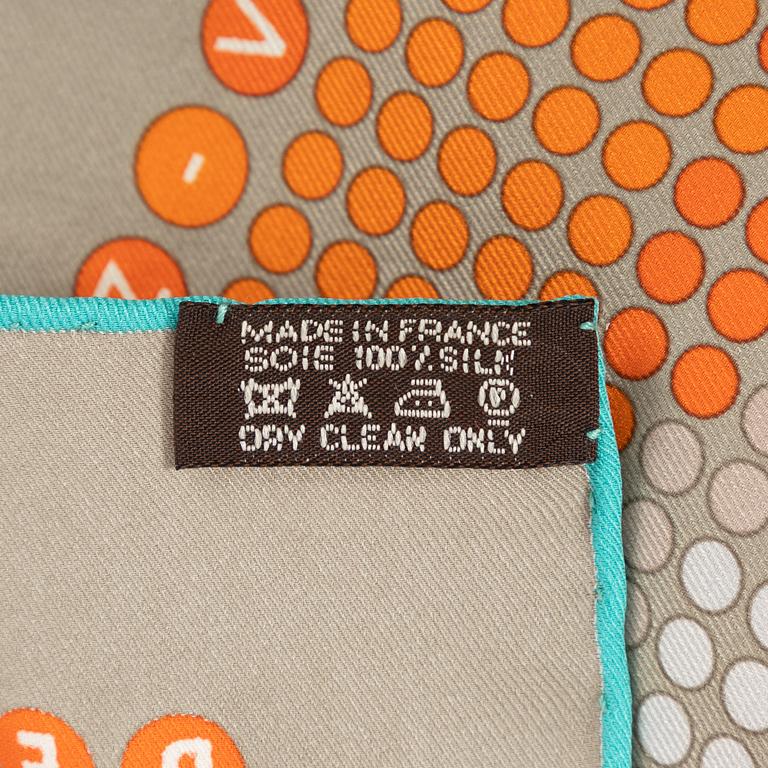 Hermès, a 'Rendez-Vous au 24' twill silk scarf.