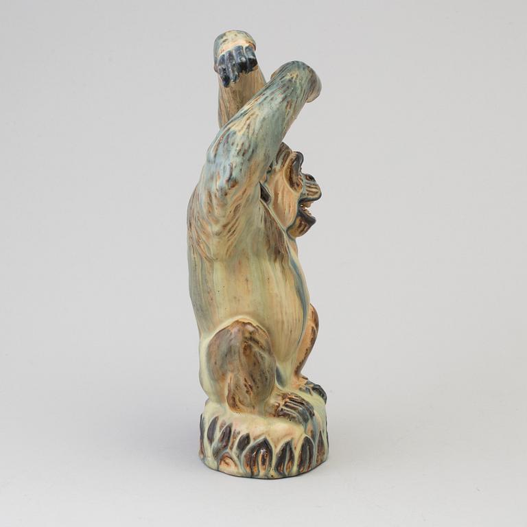 A Danish mid 20th century glazed ceramic figure of a chimpanzee, by Arne Ingdam.