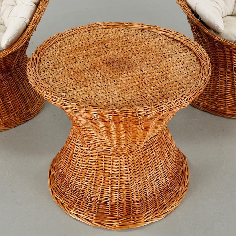 A pair of chairs and one table from the latter half of the 20th century.