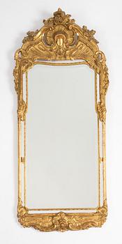 A Rococo style mirror and a console table, first half of the 20th Century.