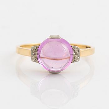 18K gold and cabochon cut syntehtic pink sapphire.