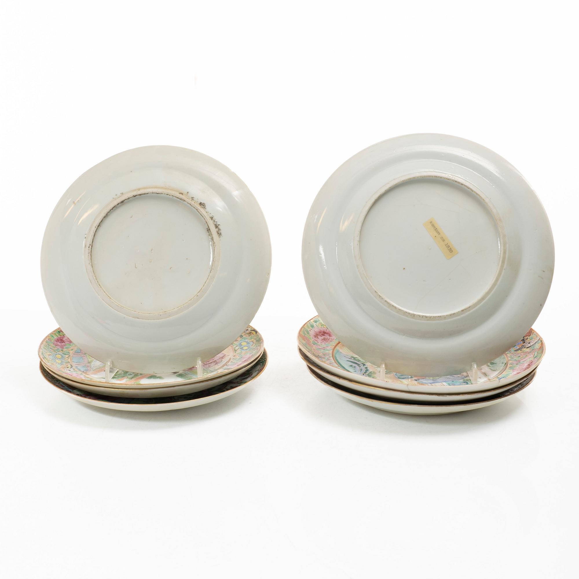A matched set of 14 famille rose 'Canton' dinner plates, Qing dynasty, 19th century.