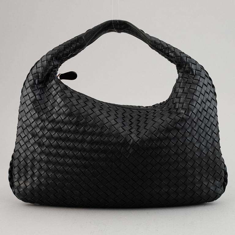 Bottega Veneta, a black leather bag.