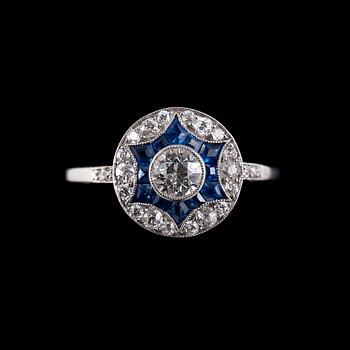 75. RING, 23 brilliant cut diamonds c. 0.67 ct. 12 fancy cut sapphires.